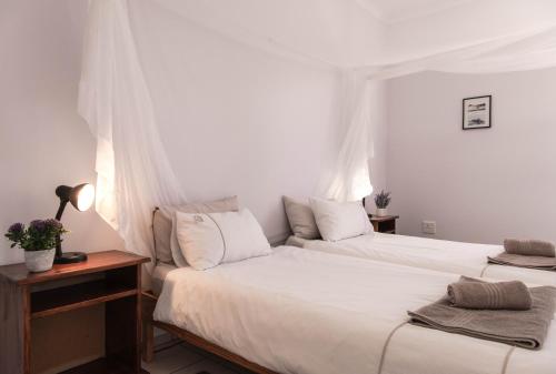 Кровать или кровати в номере Maltahöhe Hotel