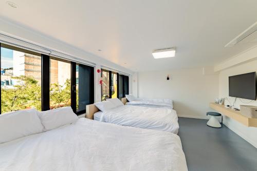Ένα ή περισσότερα κρεβάτια σε δωμάτιο στο Guesthouse Dear Moon