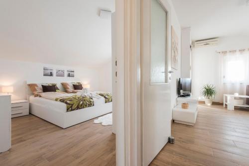Postel nebo postele na pokoji v ubytování Apartments Batur