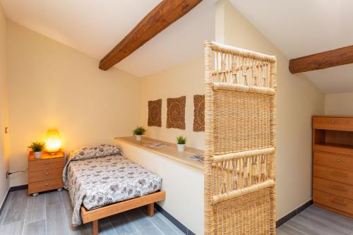 a bedroom with a bed and a dresser at Le stanze di Carla! Con cucina e bagno privato in Florence