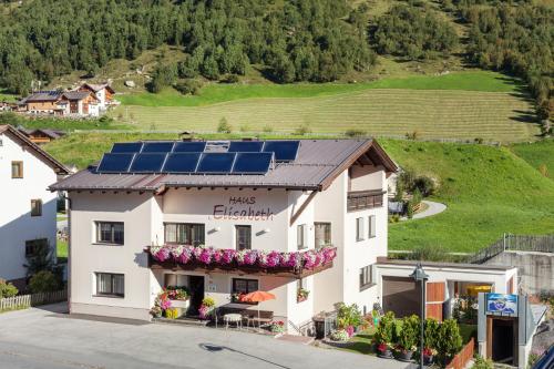 a building with solar panels on the roof at Haus Elisabeth in Galtür