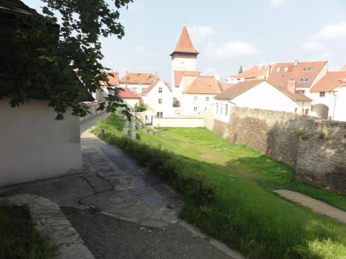 a view of a city with a wall and buildings at Penzion U Hradeb in Znojmo