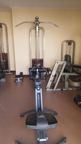 a gym with a exercise bike in a room at Esperanca Guesthouse in Windhoek