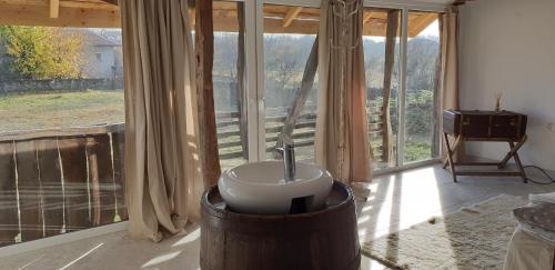 a bathroom with a sink in front of a window at Онгъл запад in Kŭrpachevo