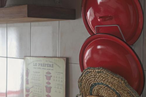 a red plate on a wall next to a box at La Casina de Luarca in Luarca