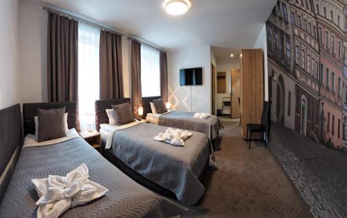 מיטה או מיטות בחדר ב-HOTEL LUBLIN