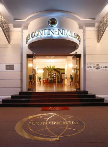 a lobby of a building with a sign that reads containment at Hotel Continental Saigon in Ho Chi Minh City