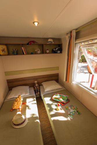Ένα ή περισσότερα κρεβάτια σε δωμάτιο στο Camping Cap Sud