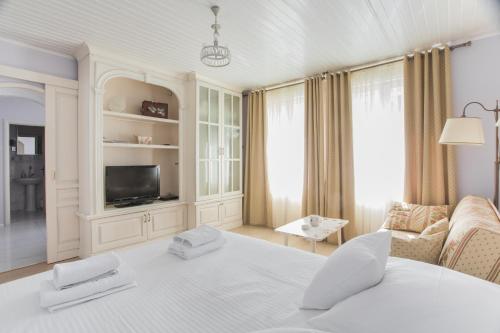 Tempat tidur dalam kamar di Shabby Chic Apartments