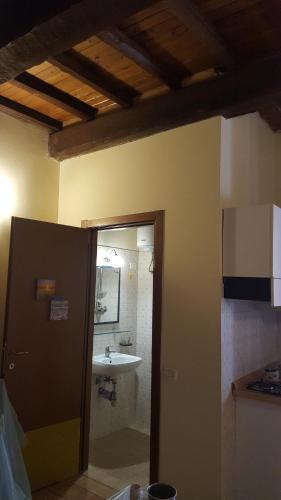 a bathroom with a sink and a mirror at Via della Posterna in Spoleto
