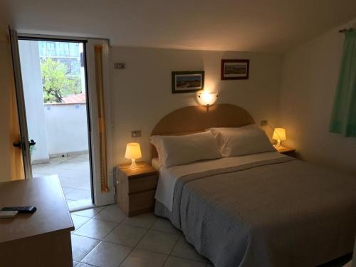 Postel nebo postele na pokoji v ubytování Hotel B&B Rispescia Grosseto