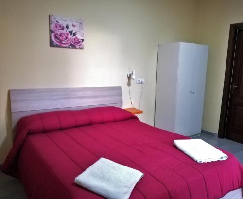a bedroom with a bed and a desk at Bed and fly Aeroporto Catania in Catania