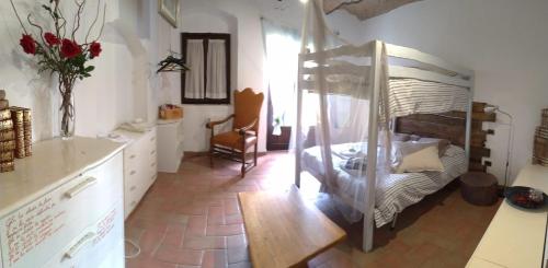 a room with a bedroom with a bunk bed at Casolare Casa Ricci in Riotorto