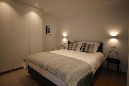 Ein Bett oder Betten in einem Zimmer der Unterkunft Vakantiewoning De Konijnenweg