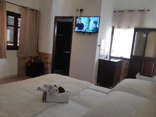 a room with a bed with a towel on it at La Casetta in Nazareth