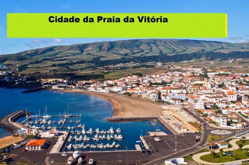 a city with a harbor and boats in the water at Príncipe de Mónaco Boutique House in Angra do Heroísmo