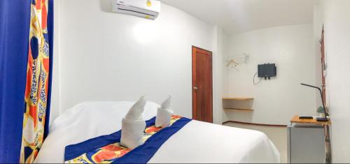Ένα ή περισσότερα κρεβάτια σε δωμάτιο στο Ban Don Holidayhome