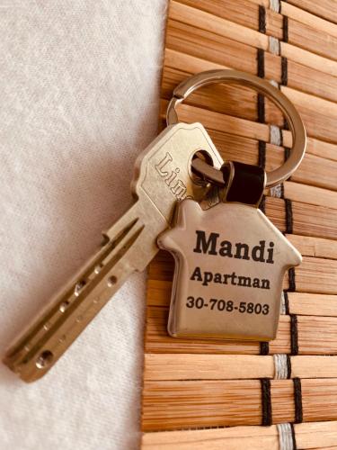a bunch of keys on a key chain on a table at Mandi apartman in Veresegyház