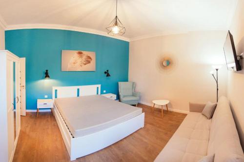 Un pat sau paturi într-o cameră la Maniu 31 Apartments & Rooms