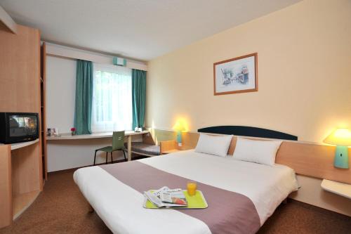 เตียงในห้องที่ Plaza Inn Berlin Süd Ludwigsfelde