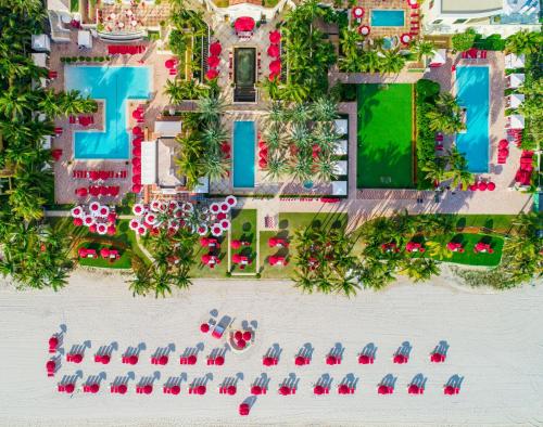 an aerial view of a resort with a pool at Acqualina Resort and Residences in Miami Beach