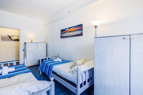 Säng eller sängar i ett rum på Il mare di Serapo