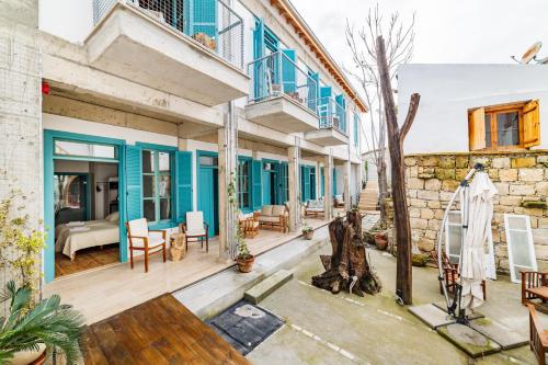 a house with blue doors and a patio at NICOSIA EAGLE EYE in Lefkosa Turk