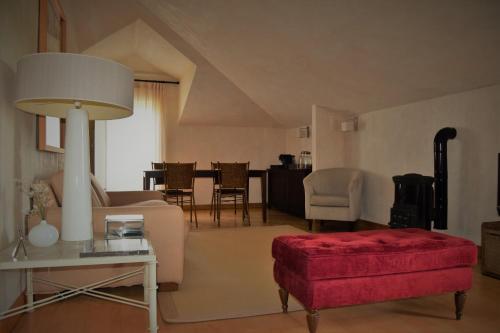 a living room with a couch and a table at Quinta De Catralvos in Azeitao