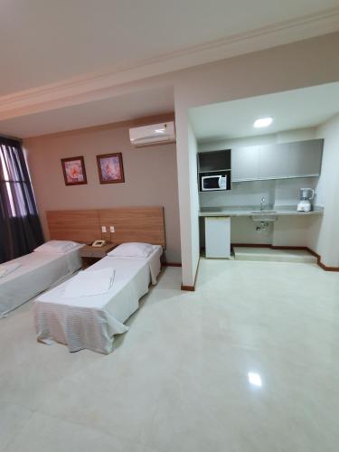 Η κουζίνα ή μικρή κουζίνα στο Guaratur Hotel