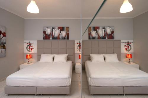 מיטה או מיטות בחדר ב-Corfu City Center Design Residence