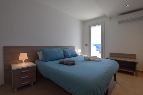 Katil atau katil-katil dalam bilik di DELPOSTO Marina di Ragusa PRL