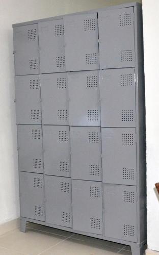 a bunch of gray lockers in a room at Vila Suítes Coliving in Vila Velha