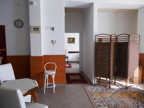 a room with two sets of gates in a room at Thelena Apartman in Tolna