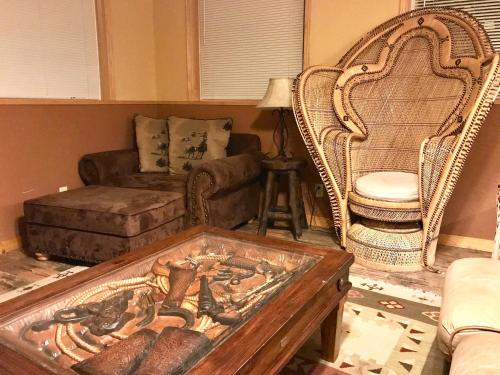 a living room with a couch and a table at Cowboy's Lodge in Gardiner