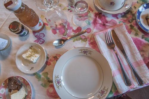 a table with a plate of cake and a spoon at l'Oca Mannara in Ameno