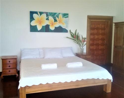 Ένα ή περισσότερα κρεβάτια σε δωμάτιο στο Ocean Breeze Bungalow