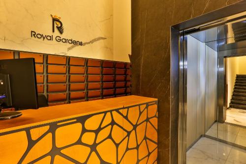 a lobby of a royal corrientes building with a counter and a window at Royal Montesun Apartments in Budva