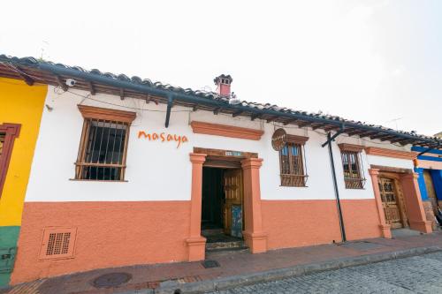 a building that has a sign on the side of it at Masaya Bogotá in Bogotá