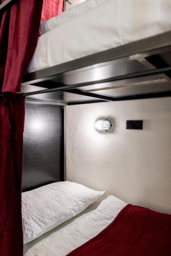 a couple of bunk beds in a room at Wake Up Wellness Hostel in Brno