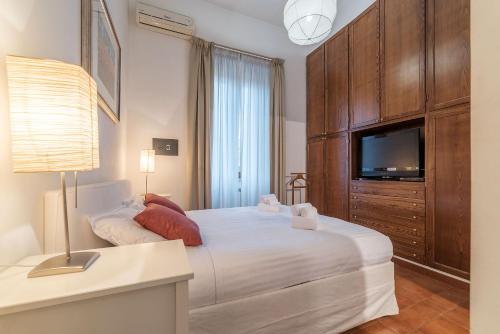 Кровать или кровати в номере Vatican Luxury Terrace