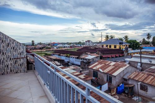 a view of a town with a train station at Triniti Airport Hotel in Dar es Salaam