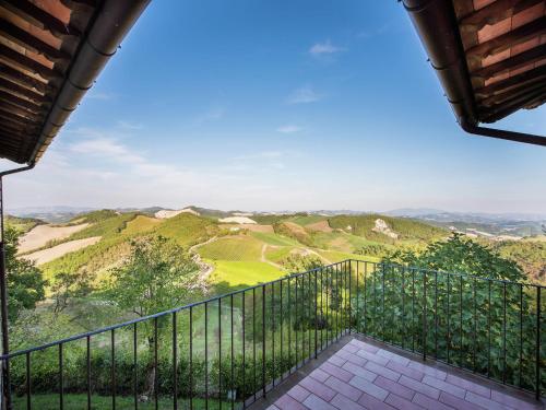 a balcony with a view of the mountains at Apartment in Sant'Angelo near Medieval Town in SantʼAngelo in Vado