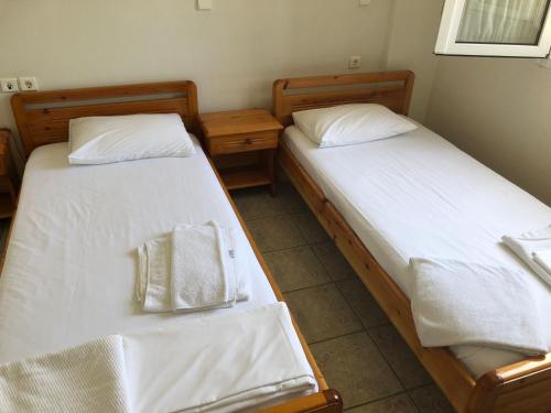 Postel nebo postele na pokoji v ubytování Mythos Suites-Poseidon apartment