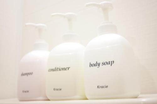 a group of white bottles with labels on them at Hanabi Hotel in Tokyo