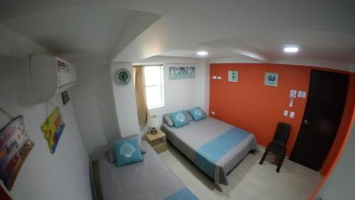 Una cama o camas en una habitación de Posada Smith Town