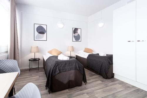 Postel nebo postele na pokoji v ubytování Forenom Serviced Apartments Rauma Kaivopuisto