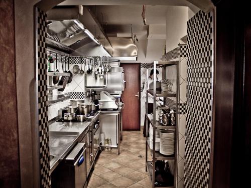 a kitchen with a sink and a stove at La Fresca in Kroměříž