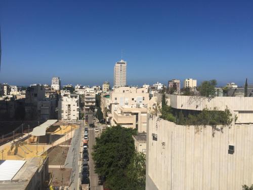 an aerial view of a city with tall buildings at Sunny Luxury Apartments in Tel Aviv