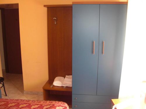 Postel nebo postele na pokoji v ubytování Hotel Legnano