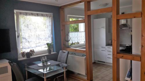 a kitchen with a table and a bunk bed at Ferienwohnungen Wittmann in Bad Staffelstein